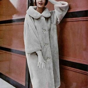 Simone d’Aillencourt in a beige sheared beaver coat by Dior, 1958